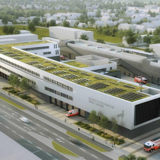 Moderne Feuerwehrstation mit begrünten Dächern und Einsatzfahrzeugen in städtischer Umgebung.