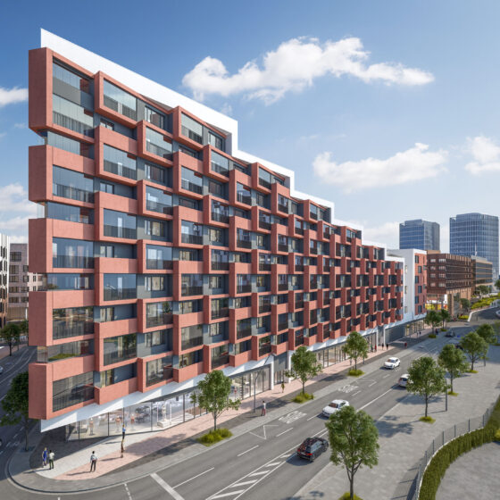 Moderne Wohnanlage in urbaner Umgebung mit roter Fassade und großen Fenstern.