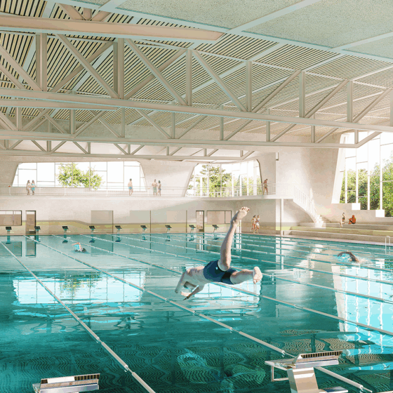 Modernes Schwimmbad mit Schwimmern, Sprungbrett und großen Fenstern für Tageslicht.