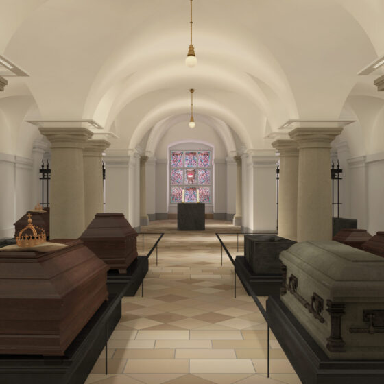 Innenansicht einer historischen Hohenzollerngruft mit Särgen und buntem Fenster.