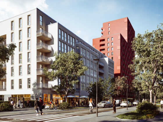 Moderne Wohngebäude mit roten und weißen Fassaden in urbaner Umgebung.