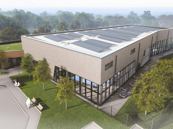 Visualisierung vom Hallenbad Stuhr von außen mit moderner Architektur mit Solarpanelen und grüner Umgebung.