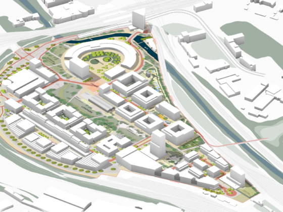 Moderne Stadtplanung: Luftaufnahme eines urbanen Entwicklungsprojekts mit Grünflächen und Gebäuden.